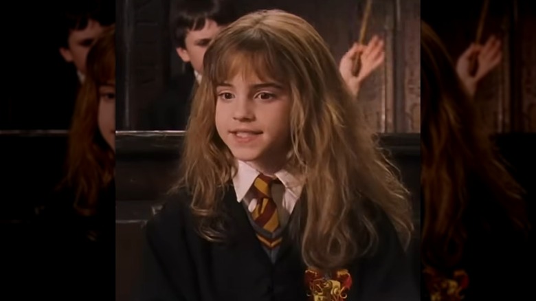 Emma Watson as Hermione Granger in Harry Potter and the Philosopher's Stone with long, dry hair and bangs