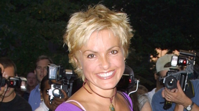 Mariska Hargitay smiling on the red carpet with very short, light blonde hair