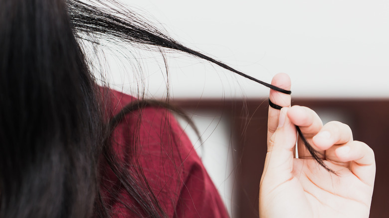 Woman pulling hair