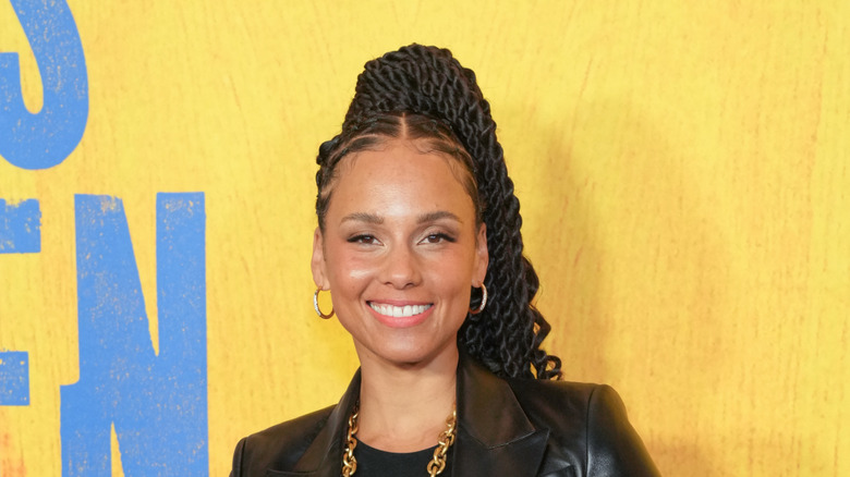 Alicia Keys with a braided ponytail