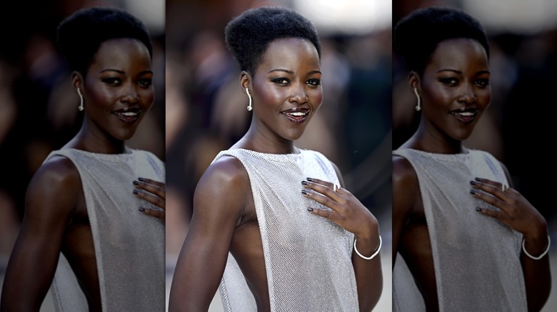 Lupita Nyong'o wearing her hair in a narrow, sculpted afro