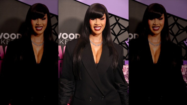 Cardi B wearing a black blazer her long hair with a side fringe
