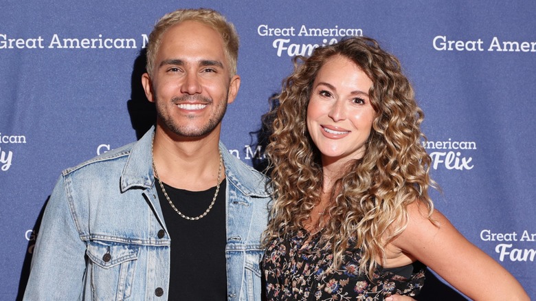 Alexa PenaVega and Carlos PenaVega posing on the red carpet