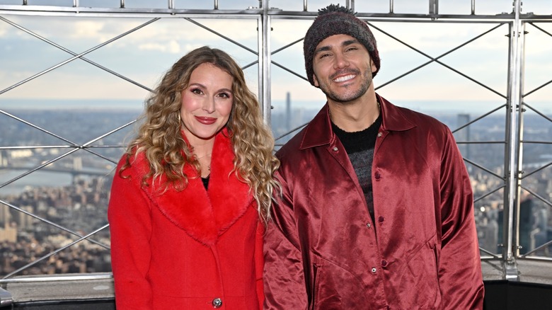 Alexa PenaVega and Carlos PenaVega posing together at the Empire State Building