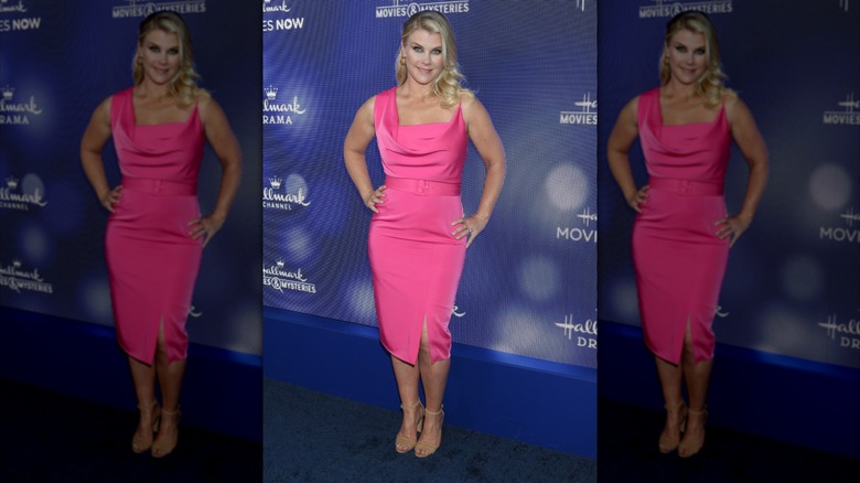 Alison Sweeney on the red carpet wearing a bright pink dress