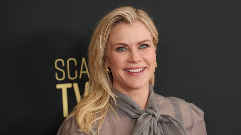A close-up of Alison Sweeney on the red carpet in a sheer gray blouse