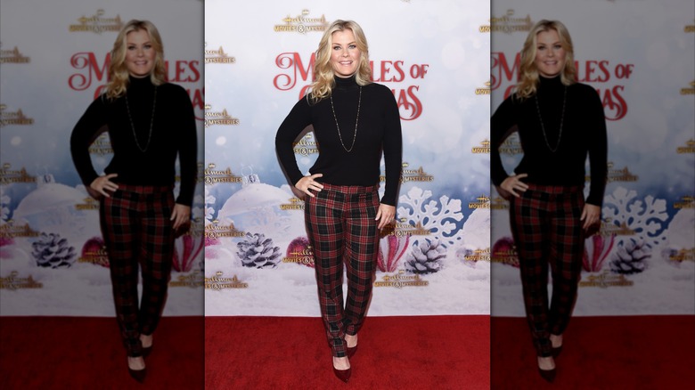 Alison Sweeney on the red carpet wearing plaid pants and a black turtleneck top