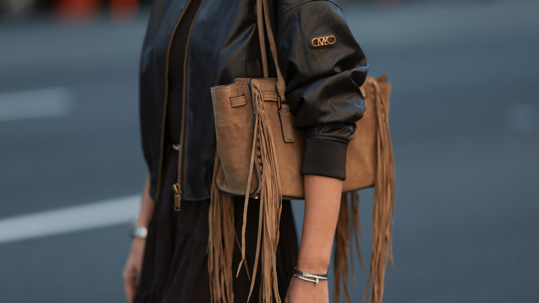 Woman wearing a fringe bag