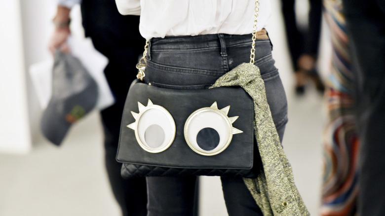 Woman with a novelty bag with eyes