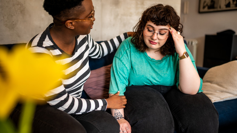 Woman being supported by friend
