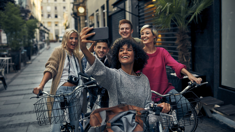 Group of friends riding bikes in city