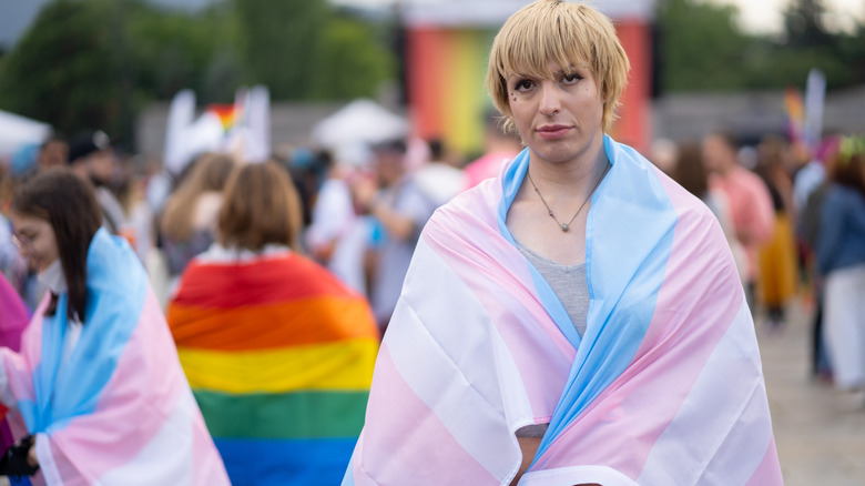 Person in transgender pride flag