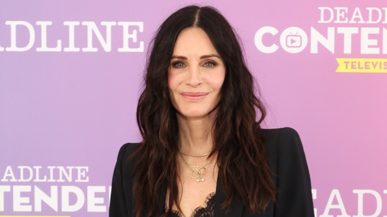 Courteney Cox smiling at an event