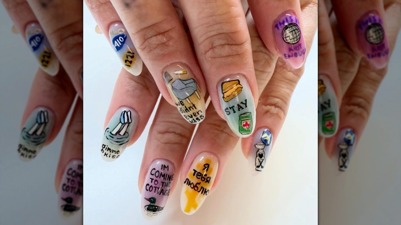 Hands showcasing "Heated Rivalry" nails in pastel tones