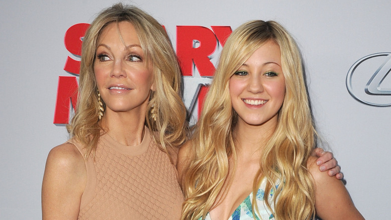 Heather Locklear and Ava Sambora smiling on the red carpet in 2013