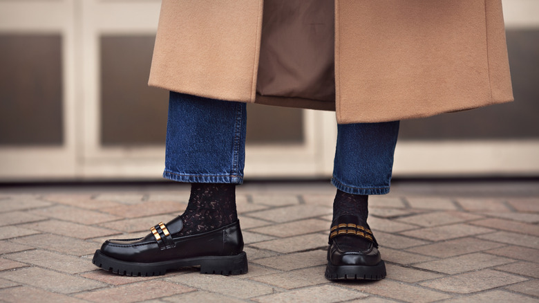 Woman standing with loafers on