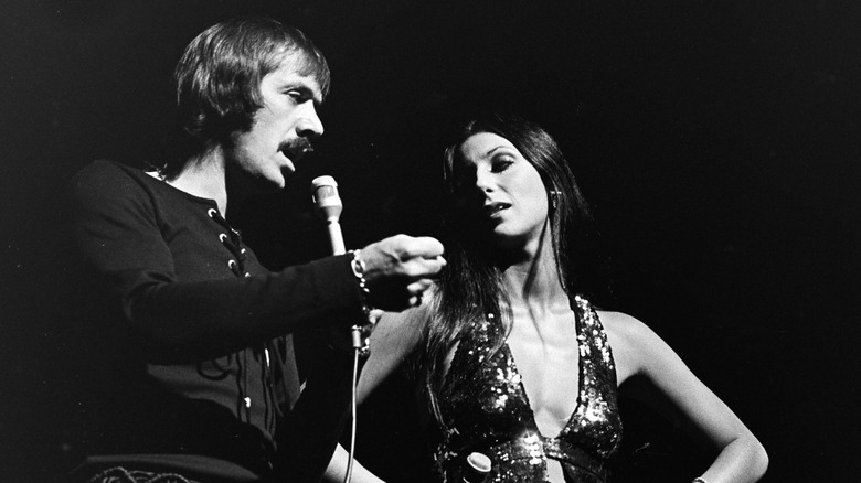 Black-and-white photo of Cher and Sonny Bono performing together on stage in 1971
