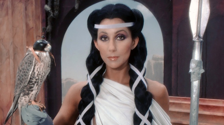 Cher posing with a bird during a 1979 photoshoot
