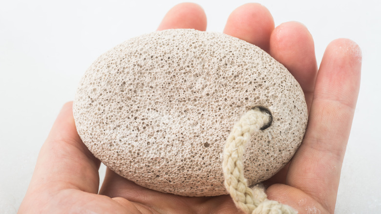 Holding pumice stone