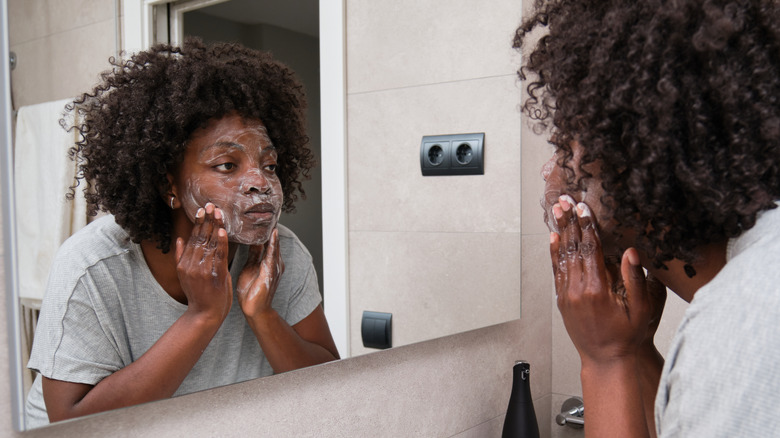 woman washing face