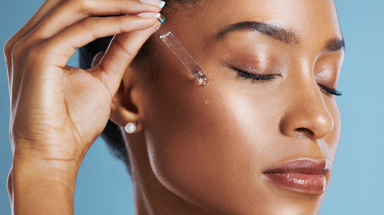 Applying face serum