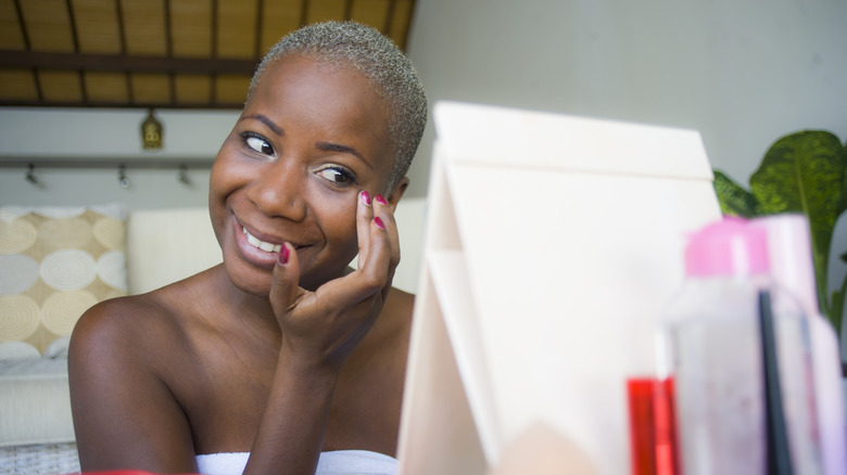 woman applying primer