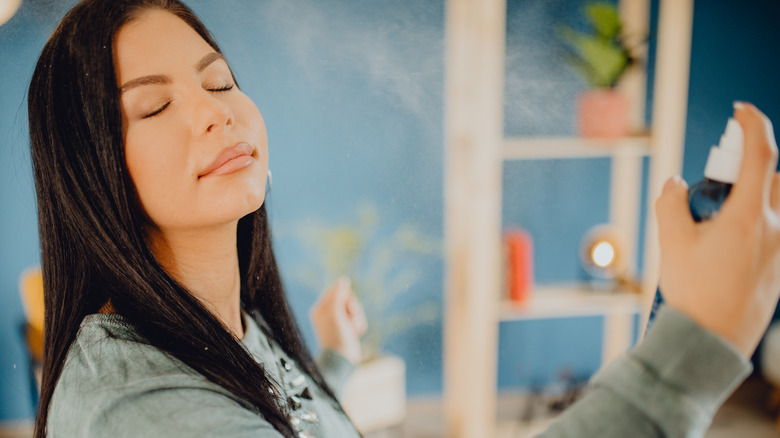 woman applying setting spray