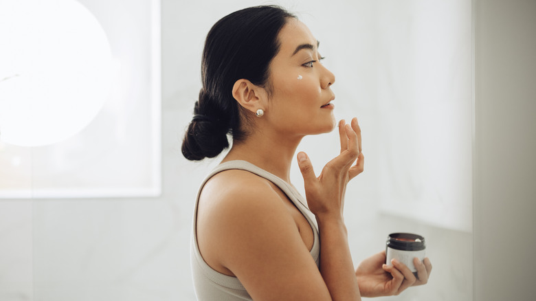 Applying face cream