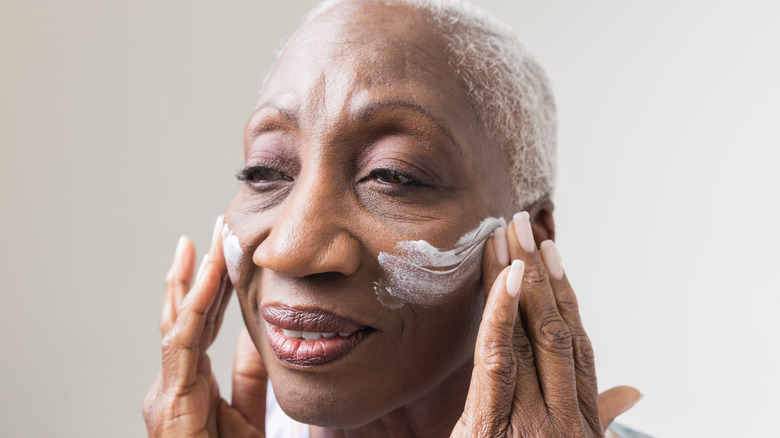 Applying face cream