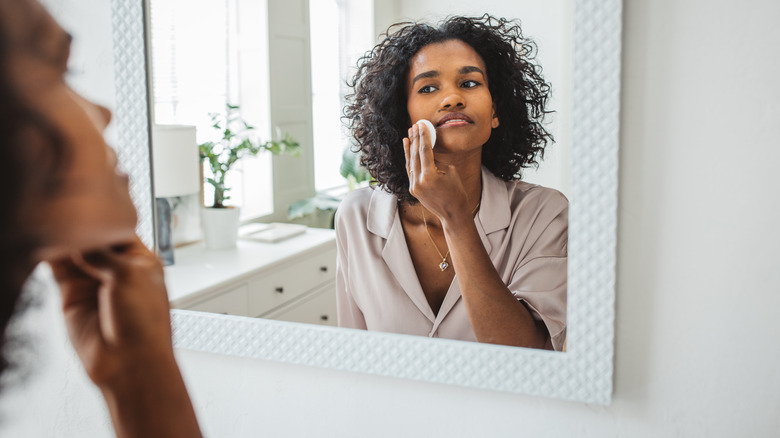 woman washing face