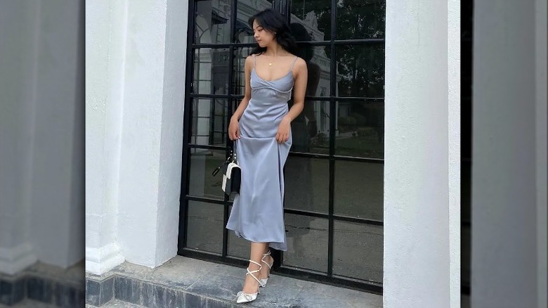 Woman in blue silk dress