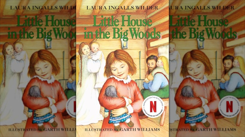 The front cover of "Little House in the Big Woods" by Laura Ingalls Wilder