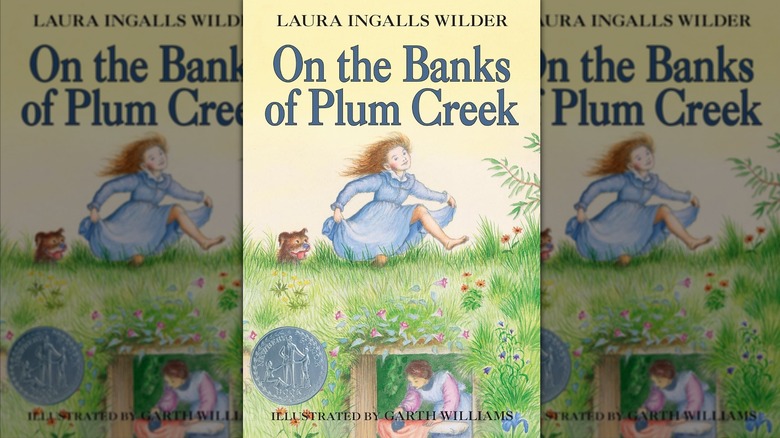 The front cover of "On the Banks of Plum Creek" by Laura Ingalls Wilder