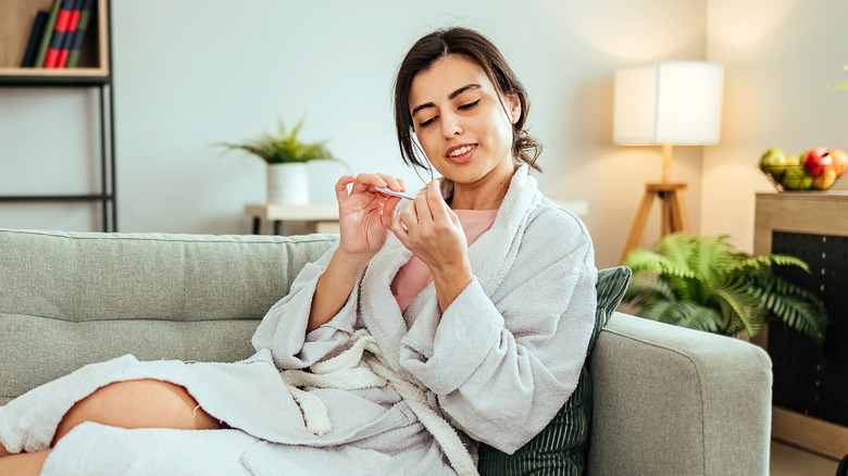 Woman filing nails