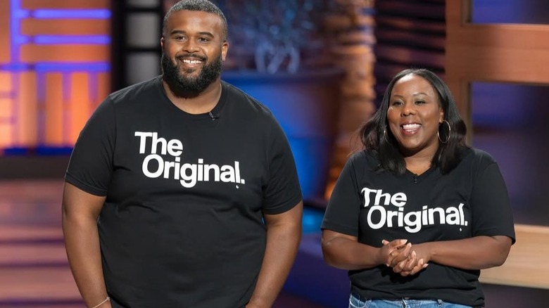 Kenny and Ashley Green wearing matching t-shirts on 