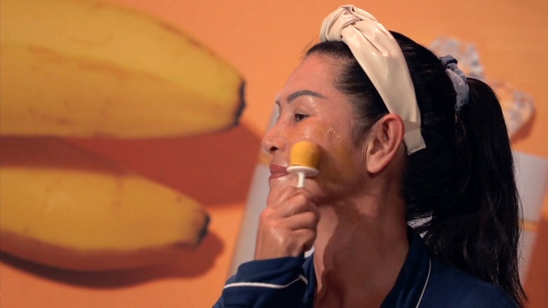 Woman displays Love & Pebble on Shark Tank Season 13