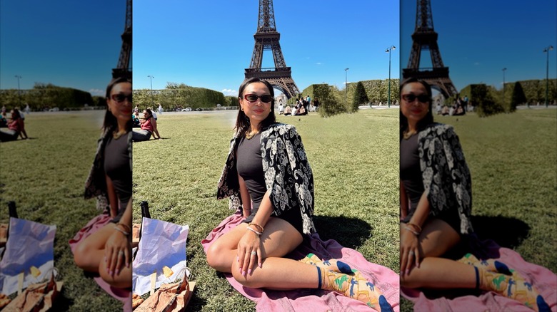 Sock Candy founder Mary Yashan Gui poses in front of the Eiffel Tower for a photo