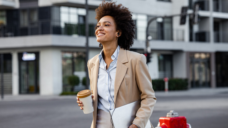 Woman walking outside and smiling