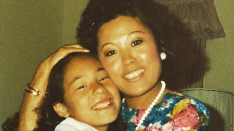 Young Joanna Gaines hugging her mom
