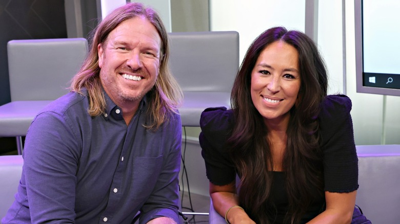 Chip Gaines and Joanna Gaines smiling together in 2021
