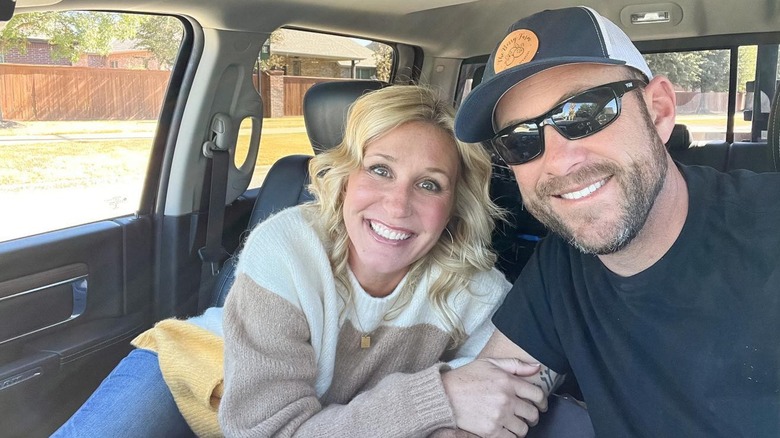 Selfie of Jenny and Dave Marrs smiling in a car