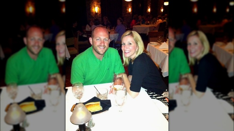 Dave and Jenny Marrs posing together at a restaurant table