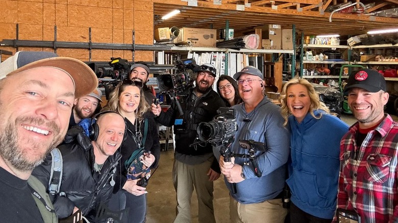 Dave and Jenny Marrs posing for a selfie with their "Fixer to Fabulous" crew