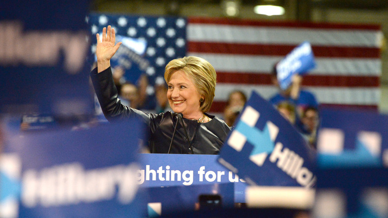 Hillary Clinton waves at a political rally
