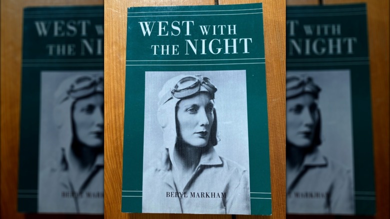 A copy of the book "West with the Night" on a table, green cover with a women pilot on the cover
