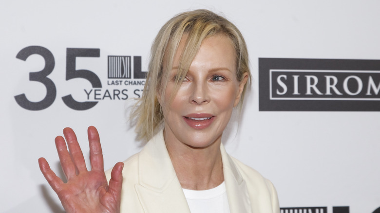 Kim Basinger waving