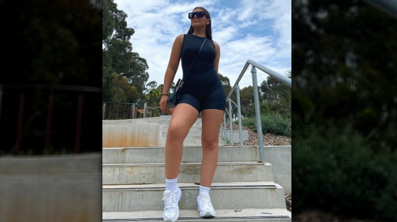 woman standing on steps