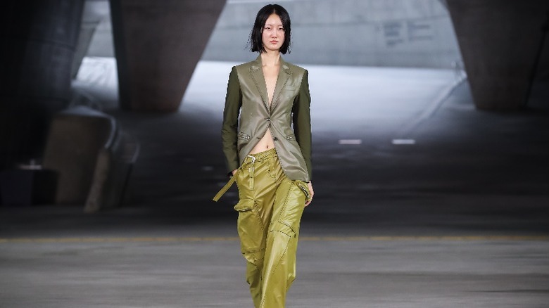 Model in green blazer