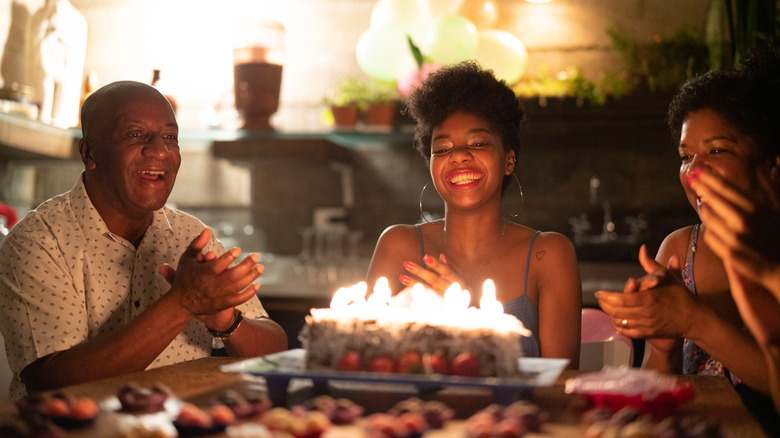 woman in front of birthday cake