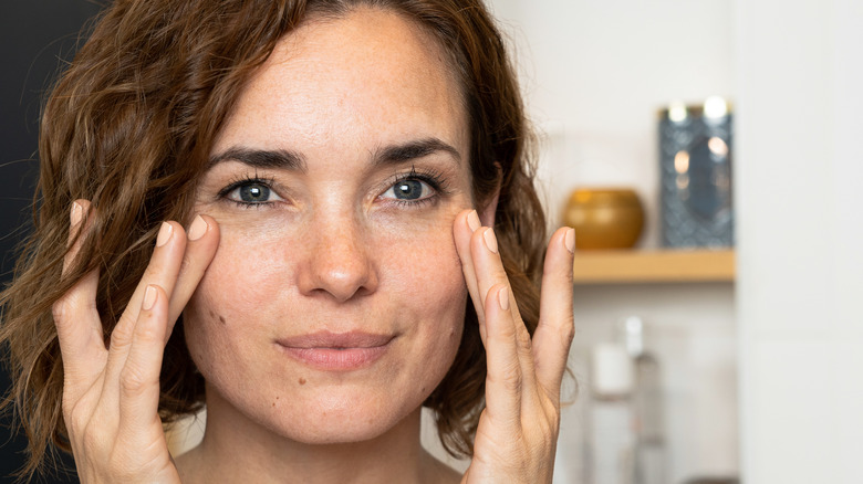woman exfoliating skin 